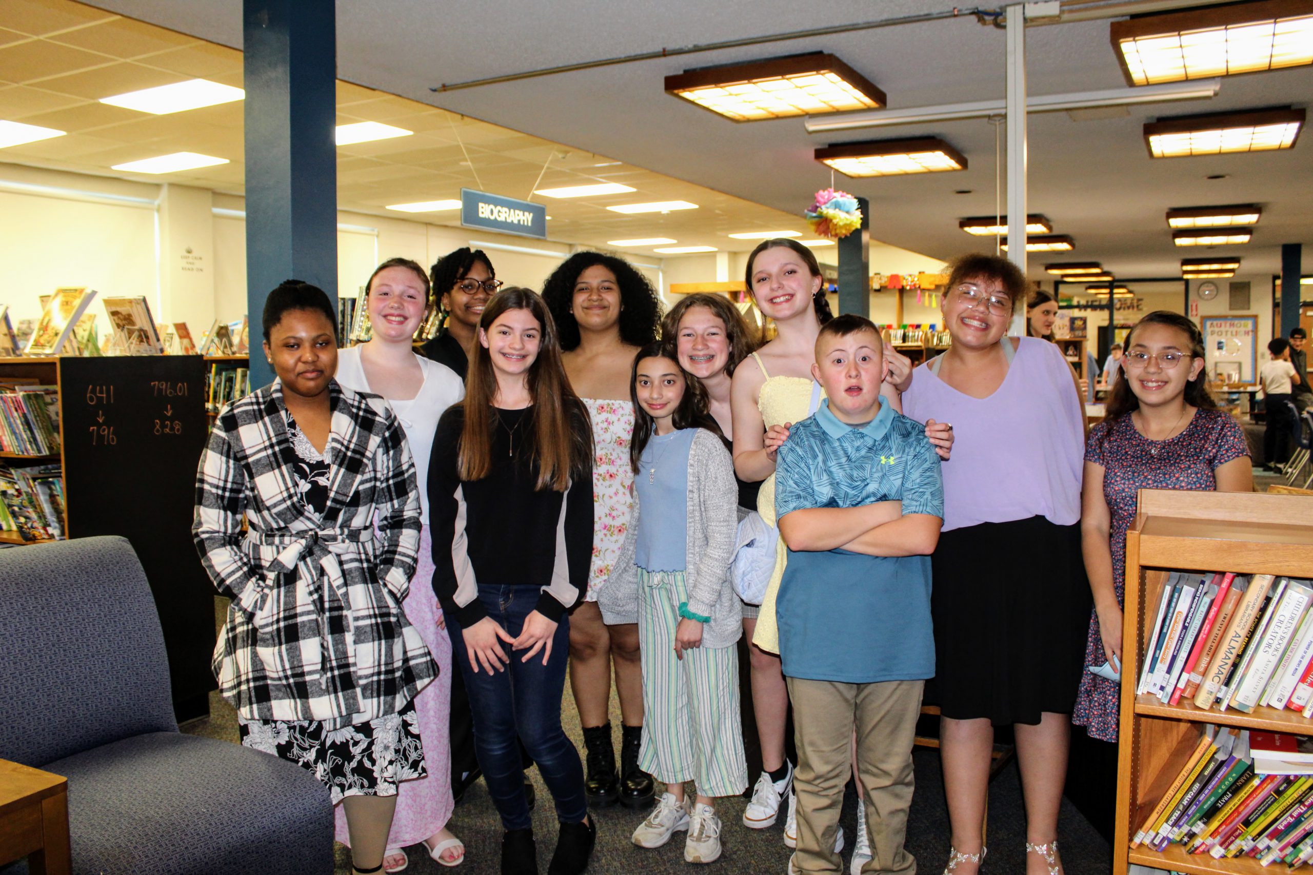 A group of Middle School students wait in the library for the National Junior Honor Society Induction