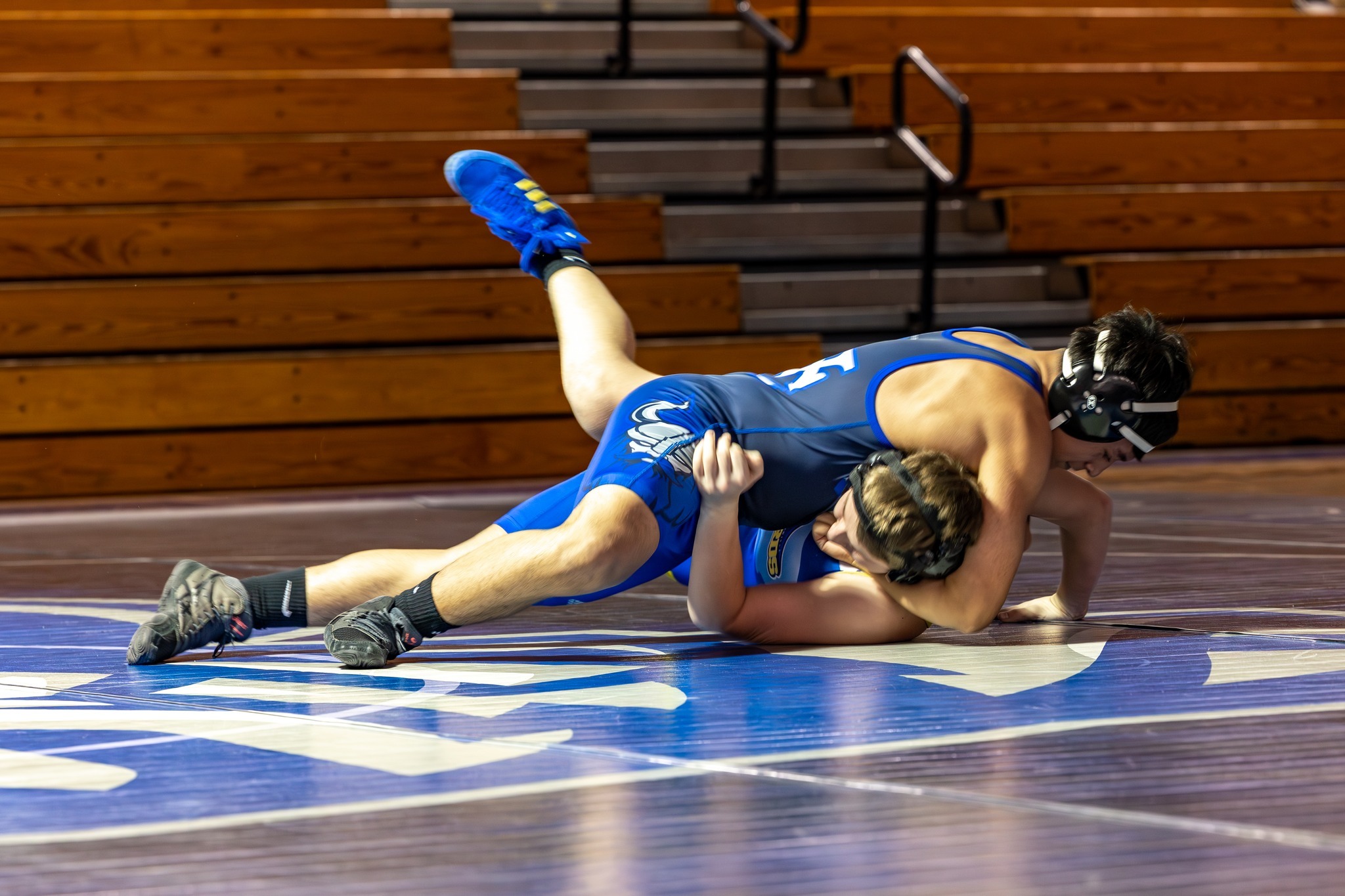 VC Boys varsity wrestler wrestling an opponent.