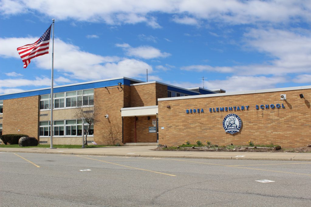Berea Elementary School building on a sunny day with the flag flying
