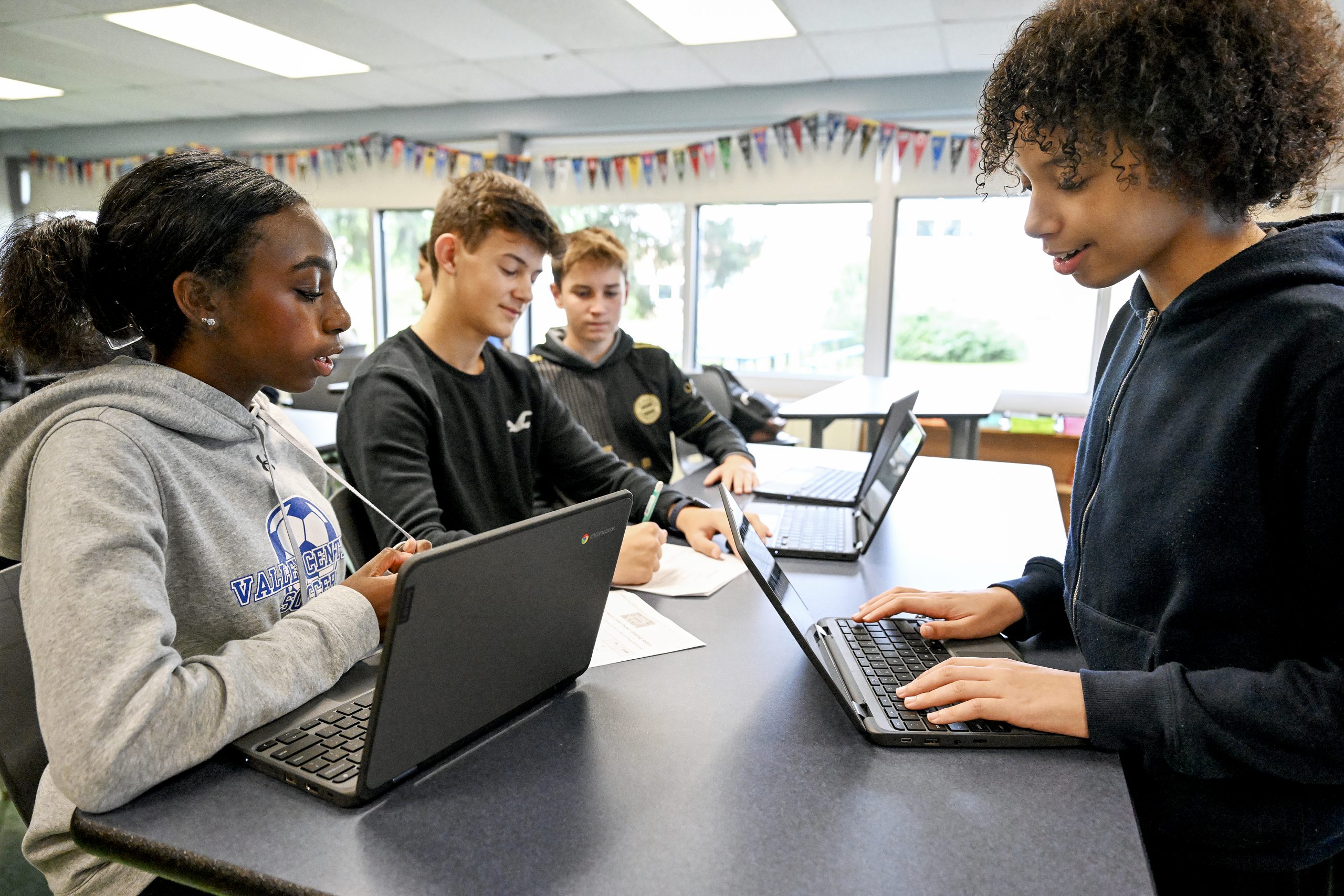 Four High Students in Business Class