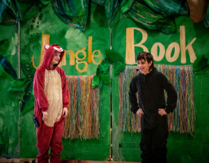 Students performing on stage during the Jungle Book. 