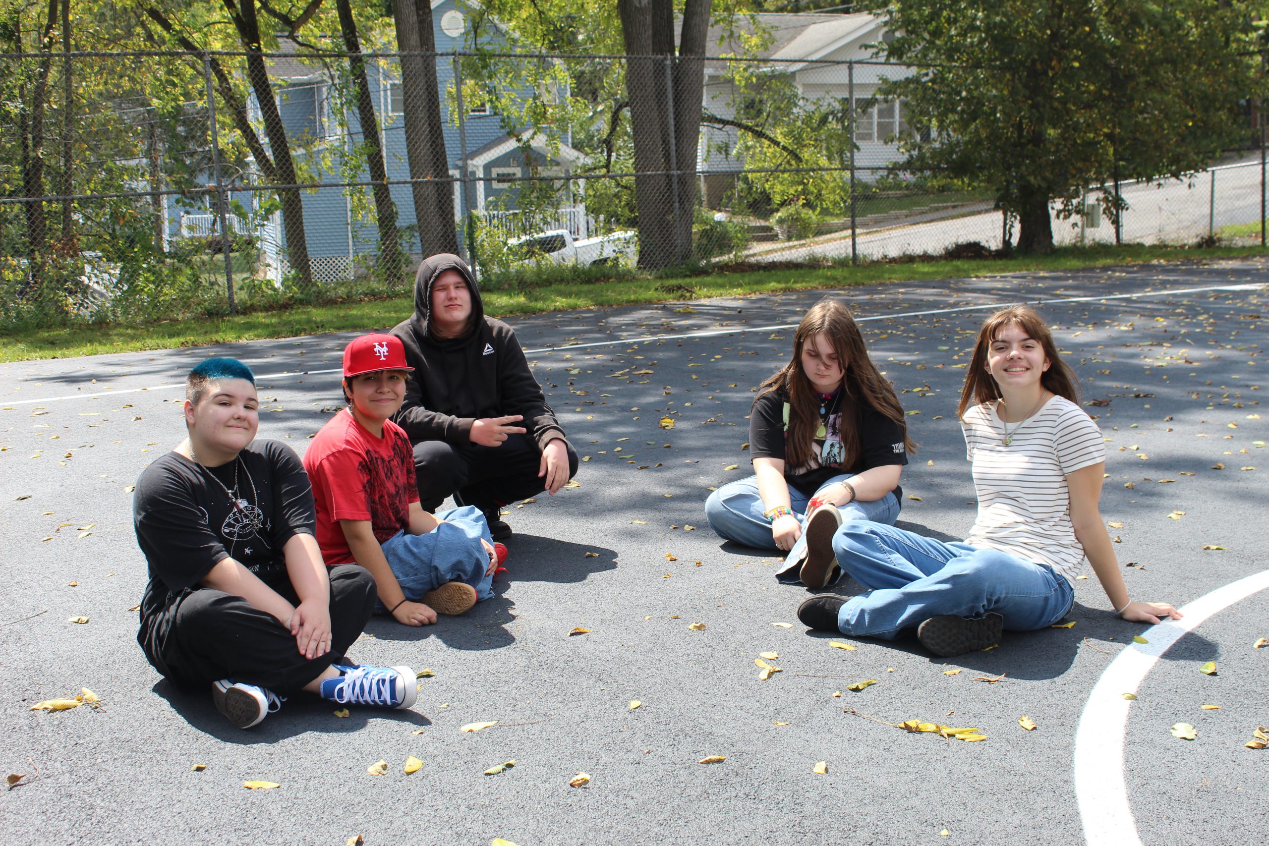 Students sit in a circle at ALC on the first day of school
