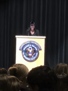 Student standing at a podium.