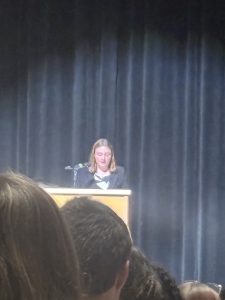 Girl standing at a podium.