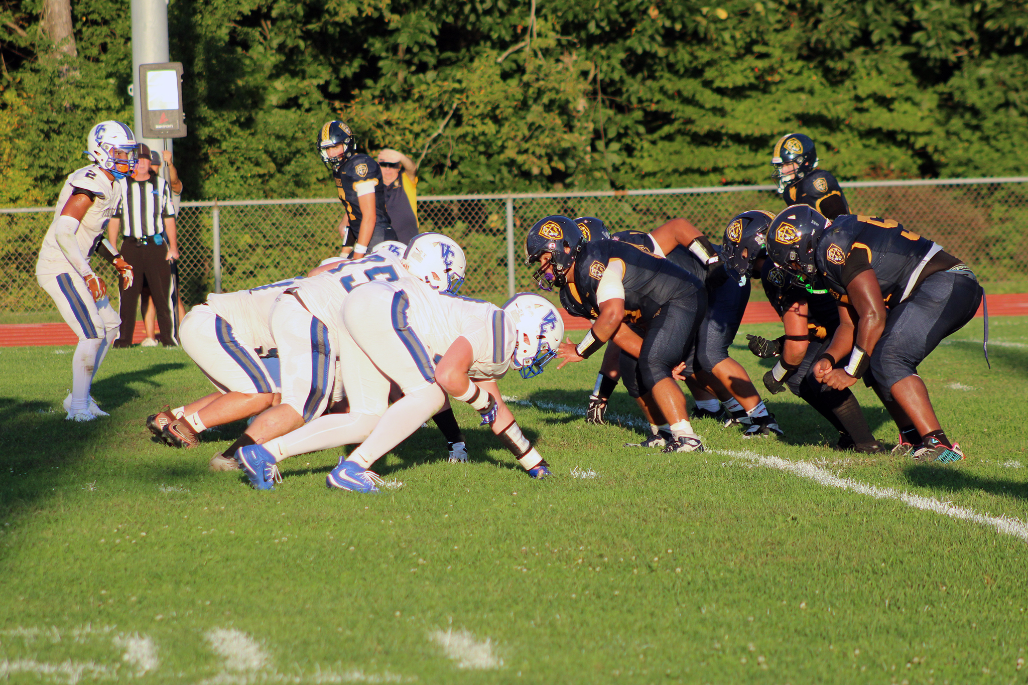 Football teams are ready for the snap.